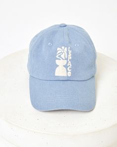 Add instant polish to any outfit with the Buns Out Baseball Cap. Pop on this easy-to-wear hat with adjustable slider strap and get ready for wherever the day takes you. Our super cute custom LSPACE Beach Club logo is found on the front and back. Baseball cap Custom LSPACE design Adjustable slider strap at back LSPACE logo at back One size Style # LSBUN24 Adjustable Casual Visor Hats, Adjustable Blue Summer Baseball Cap, Adjustable Cotton Dad Hat For Beach, Everyday Adjustable Snapback Hat With Curved Bill, Summer Dad Hat With Curved Brim, Adjustable Snapback Hat With Curved Bill For Everyday, Adjustable Curved Bill Trucker Hat For Everyday, Trendy Adjustable Cap, Trendy Adjustable Fit Cap