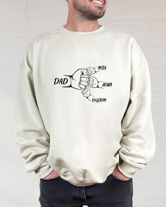 Father's Day Fist Bump Sweatshirt, Personalized Dad Shirt With Kids Names, Gift For Daddy, Fathers Day Sweater, Custom Daddy Hoodie Hi all, welcome to the Comfy Tee Design, It's so nice to see you here. If you are looking for soft, comfy and high quality sweatshirts, I have good news for you: You're at the right place!  Sweatshirts are unisex sizing. It's proper, comfortable and flattering for men and women, but may run  large for the ladies. Please see the size chart to find your perfect fit. Family Matching Graphic Print Sweatshirt, Casual Hoodie With Name Print, Casual Cotton Sweatshirt With Name Print, Customizable Long Sleeve Sweatshirt For Father's Day, Casual Long Sleeve Sweatshirt With Name Print, Casual Fall Hoodie With Name Print, Father's Day Long Sleeve Relaxed Fit Sweatshirt, Family Occasion Sweatshirt With Letter Print And Long Sleeves, Family Letter Print Long Sleeve Sweatshirt