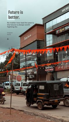 there are cars and motorcycles parked in front of a building with orange flags on it