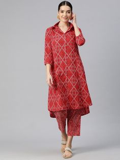 Women Bandhani Printed Panelled Pure Cotton Kurta with Trousers Product Details: Red printed Kurta with Trousers Kurta design: Bandhani printed A-line shape Panelled style Shirt collar, three-quarter regular sleeves Calf length length with high-low hem Pure cotton machine weave fabric Trousers design: Printed Trousers Elasticated waistband Drawstring closure Size & Fit The model (height 5'8) is wearing a size S Material & Care Kurta fabric: Cotton Bottom fabric: Cotton Machine Wash Specification Ankle-length Printed Motifs Salwar Kameez, Red Bandhani Print Palazzo Set With Traditional Drape, Red Bandhani Print Palazzo Set For Festivals, Red Bandhani Print Palazzo Set For Festive Occasions, Red Bandhani Print Palazzo Set For Navratri, Festive Red Palazzo Set With Bandhani Print, Red Traditional Wear With Printed Motifs For Transitional Season, Red Sets With Printed Motifs In Traditional Drape, Red Traditional Drape Sets With Printed Motifs