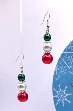 Merry Christmas and happy holidays!  Enjoy these beautiful, dangle, Christmas earrings!  So fun for the holidays!  Give as a gift or keep as a gift to yourself!  Free shipping  Sturdy, festive and fun!  So pretty with any Christmas décor!  Handmade by me.  I take great pride and care with every piece of jewelry I create! Christmas Celebration Drop Earrings Jewelry, Christmas Celebration Jewelry Drop Earrings, Holiday Jewelry With Matching Earrings, Christmas Celebration Jewelry With Matching Earrings, Beaded Jewelry For Christmas Holiday, Festive Beaded Dangle Pearl Earrings, Festive Christmas Jewelry With Matching Earrings, Holiday Dangle Jewelry With Matching Earrings, Holiday Dangle Earrings With Ear Wire