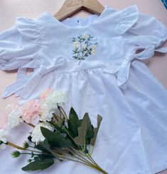 IF YOU NEED A CUSTOMIZED DESIGN, DO NOT HESITATE TO MESSAGE US! 📍 About the Dress This product is 100% handmade with hand embroidery with any design you want. We can embroider flowers, cute animals, mushrooms,.. or any other patterns and personalized with your baby name.  This dress will elevate your child's birthday celebration, formal event, or just used as every day dress. - Materials: soft cotton, linen - Size: newborn - 8 years old - Can be personalized with kid's name 📍CARE: Because it is a hand-embroidered product, please pay attention to how to wash it to make it durable - Hand wash gently with mild soap - Do not machine wash or wring vigorously - Do not iron at high temperature 📍  Shipping - They are hand-made and take time. You will receive a notification email with tracking i Hand Embroidered Dress, First Birthday Dress, First Birthday Dresses, Dress Birthday, Birthday Dress, Flower Dress, Wild Flower, Birthday Dresses, Flower Dresses