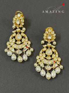 Silver Moissanite Polki Earring, Kundan Chandelier Bridal Jewelery, Traditional Jewelery 925 Silver Earring,18K Plated, Wedding Jewelery Statement Earring Drop Pearl Earring Material : Silver Gemstone: Moissanite, Drop Pearl Stone colour: Uncut Polki Primary colour: Gold Size-Length60mm Width:30mm Closure : Screw back and Clips Silver Intricate, hand crafted, Pure Silver Polki Earrings, studded with high quality Moissanite Polki comes with screw back and clips, made in 92.5 silver with 22ct gold Yellow Gold Chandbali Chandelier Earrings For Wedding, Hand Set Diamond Chandbali Chandelier Earrings, Festive Diamond Chandelier Earrings For Weddings, Luxury Rose Cut Diamond Chandelier Earrings For Wedding, Elegant Heavy Bridal Earrings For Reception, Traditional Hallmarked Chandelier Earrings For Formal Occasions, Elegant Festive Hallmarked Chandbalis, Traditional Bridal Earrings For Reception, Traditional Elegant Bridal Earrings For Reception