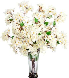 a vase filled with white flowers on top of a table