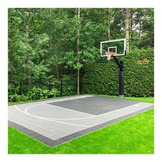 an outdoor basketball court surrounded by lush green trees