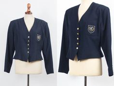 Lovely 80s vintage school uniform style blazer, navy blue color, by Cacharel. Shoulder pads, long sleeves, small waist. One front pocket with embroidery, with lining. ✂ MEASUREMENTS ✂ shoulders: 49 cm 19.3 in bust (armpit to armtip): 54 cm 21.3 in width bottom: 49 cm 19.3 in sleeve: 60 cm 23.6 in total length: 51 cm 20.1 in Size indicated: it 44 Estimated size: Small / Medium ☞ DETAILS ☜ Label: Cacharel paris Fabric: 100% virgin wool, polyester lining Condition: Good vintage condition, light use Vintage Navy Blazer For Work, Navy Fitted Vintage Blazer, Vintage Navy Blazer For Workwear, Vintage School Uniform, School Blazer, Sixties Dress, Minimal Dress, School Uniform Fashion, Navy Blue Blazer