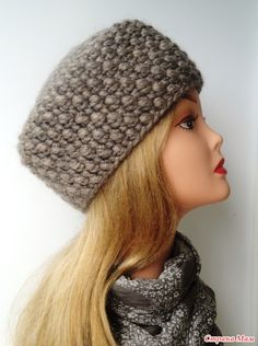 a mannequin head wearing a knitted hat and scarf with long blonde hair