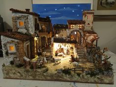 a nativity scene is displayed in front of a window