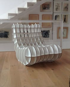 a white chair sitting on top of a hard wood floor