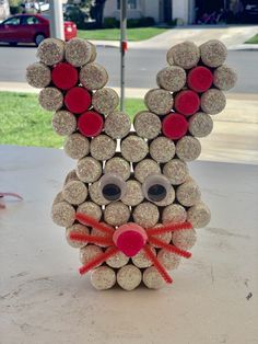 a sculpture made out of wine corks with a bunny face