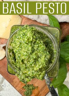 basil pest in a glass jar on a cutting board