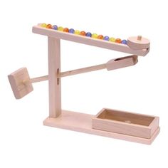 a wooden toy with beads on it and a box in the middle that is open