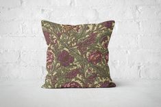 Create a luxurious atmosphere with this plum purple and moss green floral pillow cover, inspired by the timeless designs of William Morris. This rich pillow case is perfect for adding depth to your living room or bedroom and is made from high-quality materials for lasting elegance. Please note, pillow insert not included. - 100% Spun Polyester cover - Made from specially spun polyester threads, it retains it's shape, doesn't wrinkle so doesn't require ironing - Double sided print - Concealed zipper - Pillow not included Care Instructions Remove the pillows cover if it's removable. Pre-treat the stains with soft cloth or bristle brush that had been soaked in warm soap water. Machine wash, max 40oC, normal cycle. Do not bleach, do not tumble dry. Iron, steam or dry low heat only. Do not dry- Green Floral Pillow, Olive Decor, Floral Home Decor, William Morris Designs, Floral Pillow Cover, Gold Pillows, Floral Pillow, Green Home Decor, Floral Throw Pillows