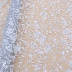 Welcome to Sunny shop. Luxury Sequin  Embroidery Lace Fabric, Wedding Dress Lace Fabric, Vintage Floral Embroidered Bridal Fabric,Couture Lace Fabric,Designer Lace This lace has an amazing look and is really very heavy. It is perfect the the most unique bridal dresses. Width about: 51inch (130Centimeters) Length : 91.44 Centimeters/ 1Yard Yarn: Rayon Mesh: Nylon Sequins: YES Beads: NO Color: Ivory Price is set for one yard. You will receive the fabric in one continuous piece if you purchase more Cream Embroidered Sequin Fabric For Wedding, White Pearl Embroidered Fabric For Mother Of The Bride, Cream Wedding Embroidered Fabric, White Embroidered Sequin Fabric For Reception, White Organza With Floral Embroidery, White Embroidered Fabric With Pearl For Wedding, White Embroidered Fabric With Pearl Embroidery For Wedding, White Embroidered Fabric With Pearl Detailing For Wedding, White Embroidered Fabric With Pearls For Wedding