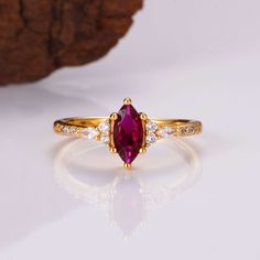 Capture fiery elegance with the Alice ring. A 1.0-carat natural ruby takes center stage, its brilliance contrasted by a luxurious gold vermeil setting. Handcrafted and unique, this ring is a timeless treasure. ✦ DETAILS ✦ ✧ Handcrafted ✧ 1.0 Carat center stone ✧ Natural gemstone ✧ Sizes 3.75-14.25 US✧ Gold Vermeil✧ Thi Latest Gold Ring Design For Women, Vintage Ruby Ring, Dainty Promise Ring, Ruby Ring Vintage, Gemstone Engagement Ring, Dainty Engagement Rings, Future Engagement Rings, Marquise Ring, Engagement Ring For Women