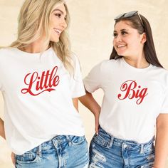 two women wearing matching shirts with the word little and big on their chests, standing next to each other