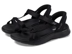 SKECHERS Performance GO WALK Flex Sandals - Illuminate Hands Free Slip-Ins - Women's Sandals : Black : Verified vegan construction. Step smart, step clever wearing the SKECHERS Performance GO WALK Flex Sandals - Illuminate Hands Free Slip-Ins. Crafted from vegan materials, this pair of sandals features heathered mesh upper with adjustable instep strap, mesh lining and EVA insole. It has open round toe, hook-and-loop closure, back heel piece, Skechers Hands Free Slip-ins for an easy fit, Heel Pillow holds your foot securely in place, contoured Goga Mat comfort footbed and lightweight, responsive ULTRA GO cushioning. Flexible traction rubber outsole. Imported. Black Sport Sandals For Summer Walking, Lightweight Adjustable Black Sport Sandals, Black Lightweight Adjustable Sport Sandals, Adjustable Lightweight Black Sport Sandals, Sporty Sandal, Athletic Sandals, Skechers Women, Sport Sandals, Sandals Black