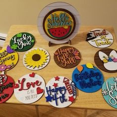 a wooden table topped with lots of decorated cookies