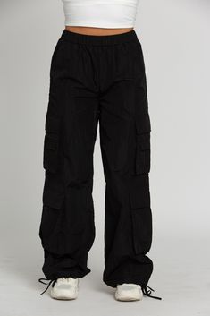 NEW Limited Edition & custom designed Shiny Black Parachute Pants! Not only did we spend months designing these amazing cargo style pants, but we PERFECTED them in the process! These pants are insanely versatile due to their lightweight material and trendy style. They feature adjustable ankle cuffs that you can lea Black Cargo Parachute Pants, Black Parachute Pants Outfit, Gold Hinge Skirt, Black Parachute Pants, Audition Outfit, Nylon Outerwear, Batman Costume, Torn Jeans, Pleated Tennis Skirt