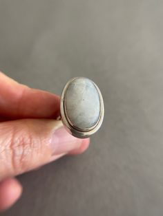 Natural White Simple Style Moonstone Oval Ring - Sterling Silver ★ Quantity : One Ring ★ Color : Silver ★ Material : Sterling Silver ★ Gemstone: Moonstone ★ Ring Size : 6 / 7 / 8 / 9 ★ Band Size : 4mm wide and 1.5mm thick ★ Oval Size : about 25mm * about 15mm ★ Comes in a jewelry box. If you need extra boxes for gifting....just let us know! Modern Oval Cabochon Moonstone Ring, Modern Oval Moonstone Ring With Large Stone, Modern Adjustable Oval Moonstone Ring, Modern Handmade Oval Moonstone Ring, Oval Moonstone Gemstone Ring, Handmade Modern Oval Moonstone Ring, Handmade Oval Moonstone Ring In Modern Style, Large Oval Moonstone Ring, Modern Oval Moonstone Jewelry