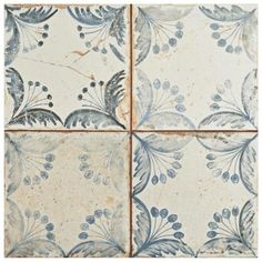 blue and white tiles with flowers on them