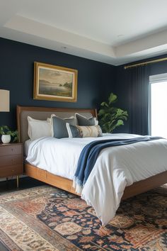 a bedroom with blue walls and white bedding is pictured in the foreground, along with a large rug on the floor