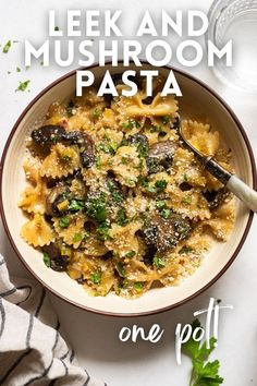 a bowl of pasta with mushrooms and parmesan cheese