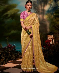 Woman standing in Yellow saree and pink blouse Indian Designer Sarees, Trending Colors