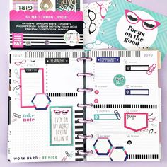 an open planner with lots of stickers on it