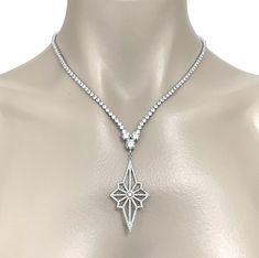 "A celestial wedding Art Deco glamour bridal necklace inspired by galaxy theme Art Deco vintage style jewelry featuring star shape pendant, made of sparkly clear cubic zirconia. This beautiful cz bridal jewelry comes in tarnish-resistant silver rhodium plated frame and chain. Necklace total length measures 17\" (43 cm) when opened up and put on a straight line. It secures with a snap clasp. View matching pieces or similar designs at https://etsy.me/2UYs0c3 See all geometric designs at https://et Art Deco Wedding Pendant Jewelry, Luxury Celestial Wedding Necklaces, Silver Art Deco Necklaces For Formal Occasions, Elegant Star-shaped Wedding Necklaces, Silver Platinum Art Deco Necklace, Art Deco Jewellery Design, Celestial Wedding, Vintage Style Jewellery, Cz Jewelry