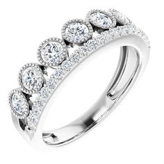 a white gold ring with three rows of diamonds on the side and two rows of round cut