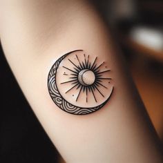 a black and white tattoo on the arm of a woman with a crescent moon design