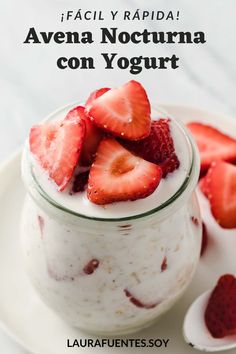 there is a bowl of yogurt with strawberries on top