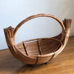 a wicker basket sitting on top of a wooden floor