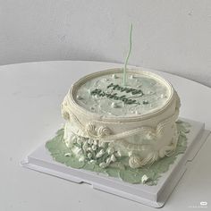 a white cake sitting on top of a table