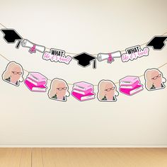 a wall with some stickers hanging from it's sides and graduation decorations on the side