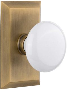 an image of a white light on a brass plated wall mounted fixture with a round glass ball