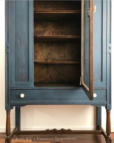 an old blue cabinet is painted with chalk paint and waxed to look like wood