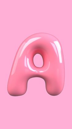 a pink donut shaped object on a pink background