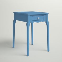 a small blue table sitting on top of a white floor