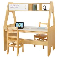 a wooden desk and chair with a laptop on it, next to a book shelf