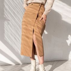 Elegant High Waist Front Split Midi Skirt - Uniqistic.com Chic Wrap Skirt With Pockets For Work, Beige Pencil Skirt For Fall, Fall Beige Pencil Mini Skirt, High Waist Relaxed Pencil Skirt For Fall, Winter Lined Pencil Skirt, Winter Pencil Skirt With Pockets, Fall Pencil Skirt With Pockets, Lined Pencil Skirt For Winter, Winter Workwear Skirt