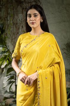 Yellow saree with zardozi embroidered floral motifs, embellished by sequins. Comes with matching blouse and petticoat. - Aza Fashions Designer Art Silk Pre-draped Saree With Zari Work, Festive Silk Pre-draped Saree With Dori Work, Festive Blouse With Dupatta In Chinon, Festive Chinon Blouse With Dupatta, Eid Art Silk Blouse With Mirror Work, Navratri Pre-draped Saree With Resham Embroidery In Dola Silk, Navratri Silk Pre-draped Saree With Dori Work, Tissue Silk Blouse With Mirror Work For Reception, Silk Pre-draped Saree With Zari Work For Reception