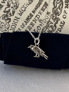 Sterling Silver Raven Necklace - Tiny Raven, Messenger Bird, Raven Necklace, Raven Gift, Symbolic Jewelry, Myths and Legends, Viking Jewelry All components are sterling silver.  ✦pendant measures:  13x15mm ✦sterling silver box or cable chain length choices below ✦model wearing a cable style chain in size 20" **PLEASE NOTE: THIS LISTING IS ONLY FOR ONE NECKLACE ONLY. ** 🎁 Comes ready to gift in a gift box or bag. ♥BUY WITH CONFIDENCE♥ Please know I take customer service very seriously! There is Raven Messenger, Messenger Bird, Raven Necklace, I Want More, Myths And Legends, Symbolic Jewelry, Happy Customer, Viking Jewelry, Silver Box