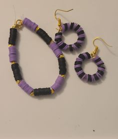 two pairs of purple and black beaded earrings