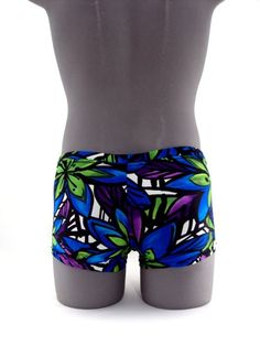 "Designed with a vibrant look sure to turn heads,this men's swimsuit lights up the beach or pool in refreshing style,this eye-catching stretch nylon square cut swimsuit for men stands out for all the right reasons. MADE IN USA PLEASE NOTE: All print fabric designs swimsuits varies, no two are alike. Drawcord waist 7\" Inch Side seams 3/4 inch waist elastic 3/8 inch leg elastic Center seam front pouch" Blue Fitted Boxer Briefs For Summer, Summer Fitted Blue Boxer Briefs, Fitted Blue Boxer Briefs For Summer, Multicolor Fitted Swim Trunks For Pool, Tropical Fitted Shorts For Swimming, Fitted Green Swim Trunks For Summer, Fitted Multicolor Swim Trunks For Swimming, Blue Stretch Boxer Briefs For Beach Season, Fitted Boxer Briefs For Beach Season