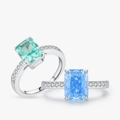 Introducing the epitome of elegance and sophistication: our Luxurious Paraiba Ice-Cut Cubic Zirconia Cocktail Ring. This stunning piece captures the exquisite beauty of the rare Paraiba gemstone with its vibrant color and unique crushed ice cut, offering an eye-catching sparkle that mimics the allure of tropical seas. Set in a classic cocktail ring design, it combines timeless luxury with contemporary flair. Crafted with precision, this ring features high-quality cubic zirconia, chosen for its s Elegant Topaz Ring With Moissanite Accent Stones, Formal Topaz Ring With Moissanite Accent Stones, Elegant Green Topaz Ring With Diamond Accents, Elegant Green Topaz Ring With Diamond, Elegant Radiant Cut Diamond Topaz Ring, Elegant Moissanite Emerald Ring With Accent Stones, Exquisite Emerald Ring With Brilliant Cubic Zirconia Cut, Exquisite Emerald Ring With Brilliant Cut Cubic Zirconia, Elegant Diamond White Emerald Ring With Accent Stones