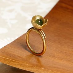 Small flower ring decorated with carnelian, jade or freshwater pearl, a bohemian style to dress every day. CHECK OUR PROFILE IF WE HAVE ANY OFFER OR CODE AVAILABLE! https://www.etsy.com/es/shop/AtelierBcnJoiaShop ► We know that this year the world is a little crazy. The online sales have made the normal shipping services collapse, so from the team of Atelier BCN Joia we wanted to make the effort and propose that buying 2 pieces we make you a FREE and extra FAST shipping with a private company. W Unique Gemstone Flower Ring For Wedding, Elegant Handmade Brass Flower Ring, Handmade Elegant Brass Flower Ring, Handmade Green Flower Ring For Weddings, Bohemian Green Flower Ring For Gift, Bronze Flowers, Olive Leaf Ring, Bohemian Jewels, Botanical Ring