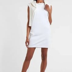 This Mini Dress Is Ready For Anything Thanks To Soft, Lightweight T-Shirt Fabric, Chic Padded Shoulders And A Comfy Shift Fit. Crew Neck Padded Shoulders; Cap Sleeves Straight Hem Mini Length 36.5" Long Cotton Stretch Cotton Dresses With Crew Neck, Stretch Cotton Crew Neck Dresses, White Fitted Mini Dress With Crew Neck, Cotton Stretch Dresses With Crew Neck, Stretch Cotton Crew Neck Mini Dress, White Chic Crew Neck Mini Dress, White Cotton T-shirt Dress With Crew Neck, White Cotton Crew Neck T-shirt Dress, White Crew Neck Mini Dress For Spring