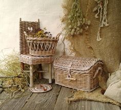 two wicker baskets sitting on top of a wooden floor